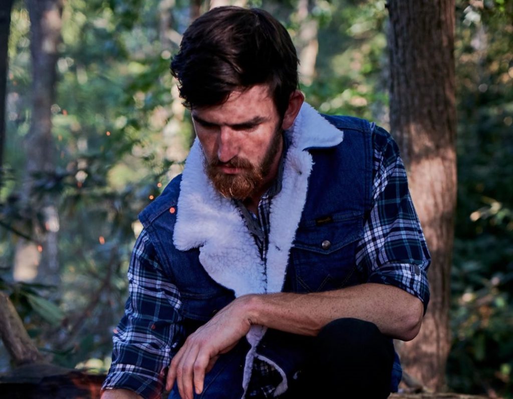 cowboy wearing denim vest