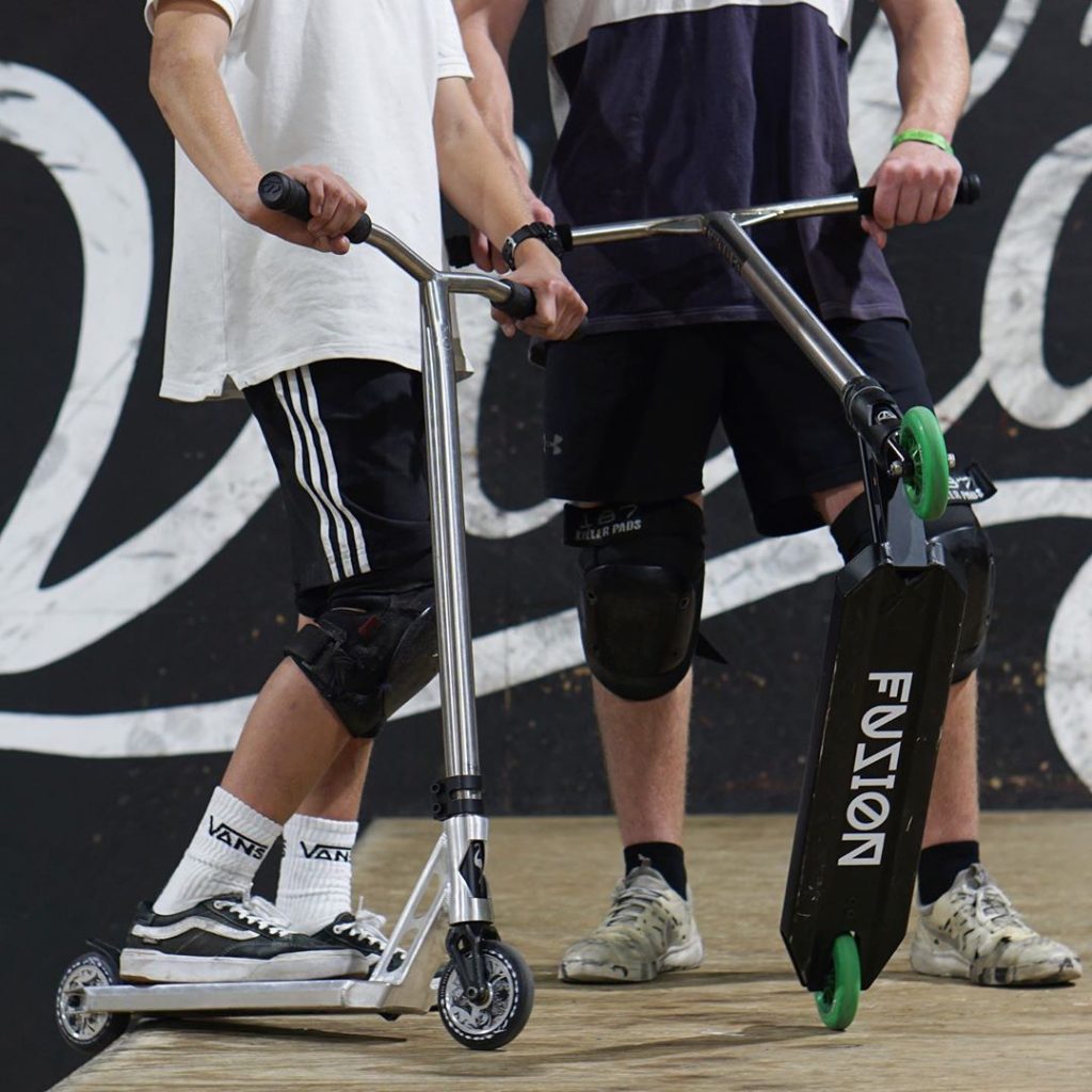 boys riding electric scooters