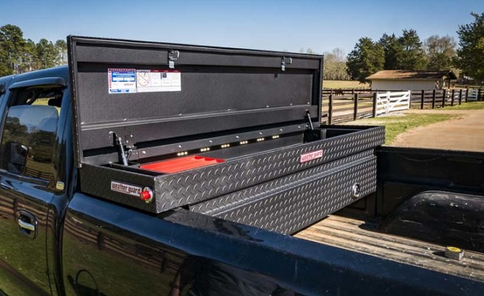 picture of truck with aluminum storage toolbox installed parked on a farm