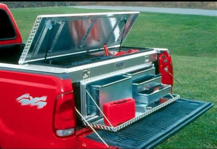 picture of a red truck with aluminum tray storage on the back