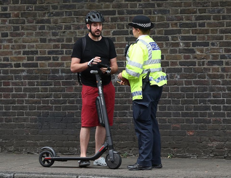 scooter driver stopped by police officer