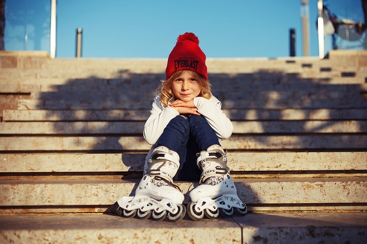 picture of a little girl on a stairs with skates