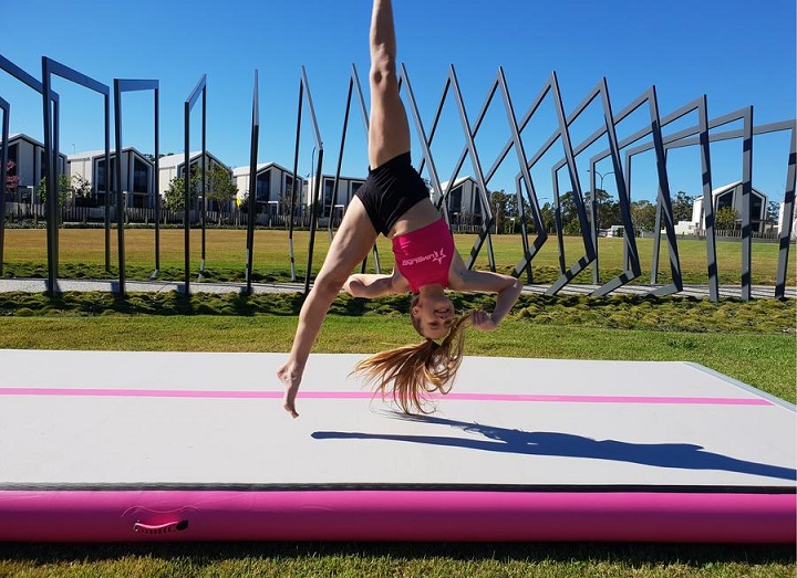 Girl practicing on air track