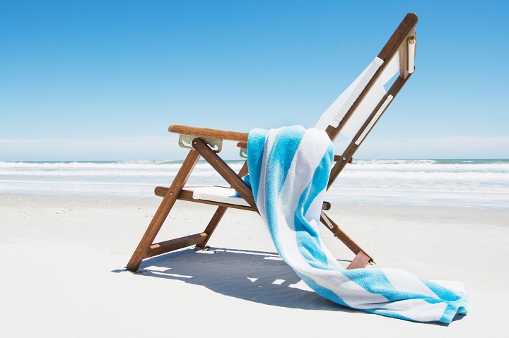 blue and white beach towel on chair