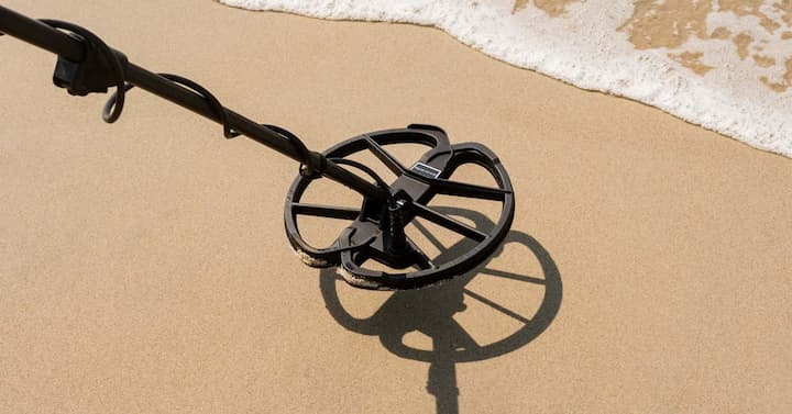 Metal detector on sand on the beach