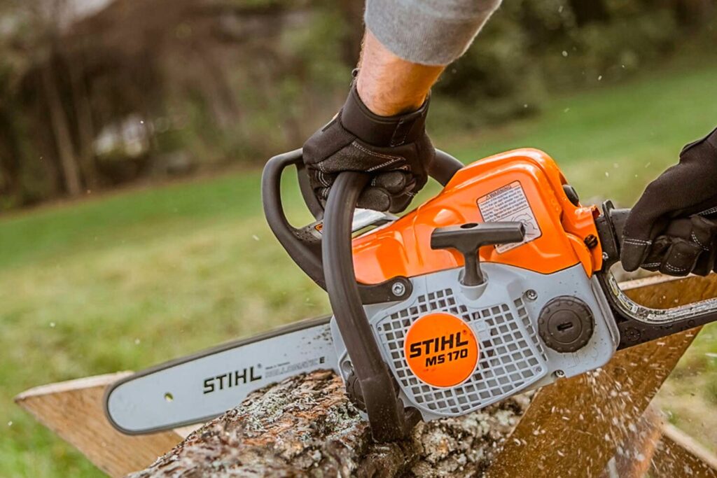 Man working with chainsaw