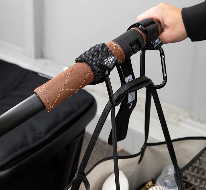 picture of a clip on a baby pram and a bag