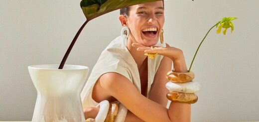 picture of a woman smiling sitting on a table, wearing resin bangle designed