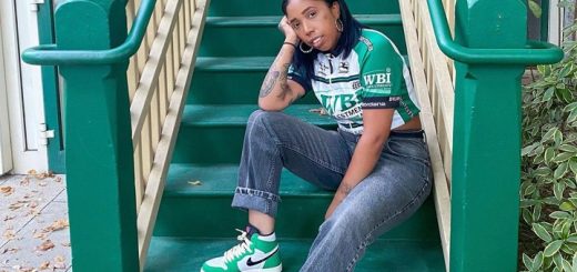 girl sitting on stairs dressed in retro style