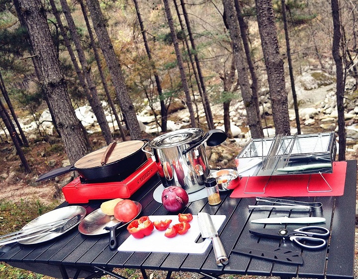 Camping cooking hardware on table in nature