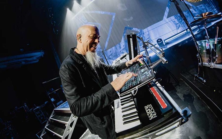 a guy playing a synthesizer
