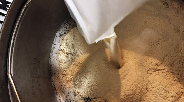 putting on malt extract in a large pot