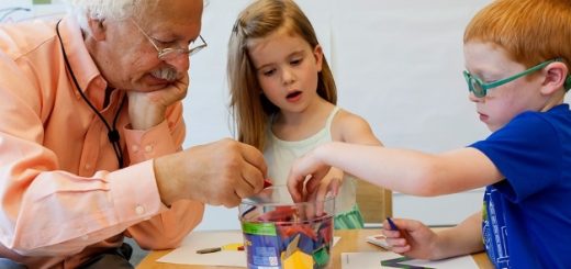 a man and two kids playing math games