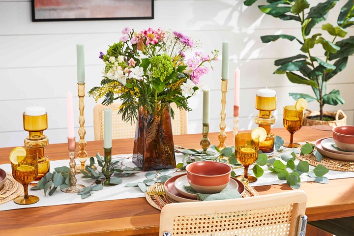 colorful dinning table with candles and flowers